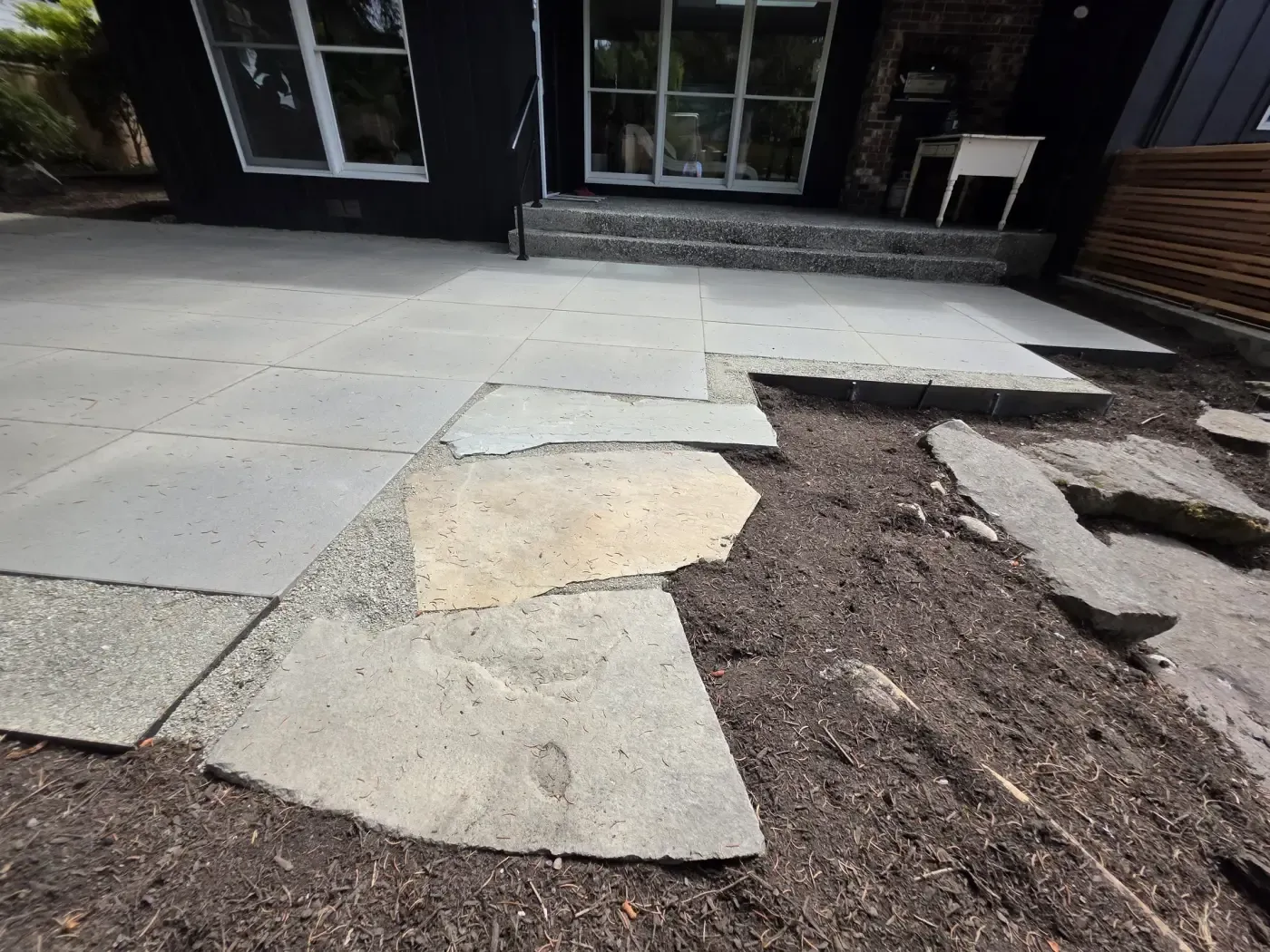 Flagstone apron blended into cut stone patio at steps
