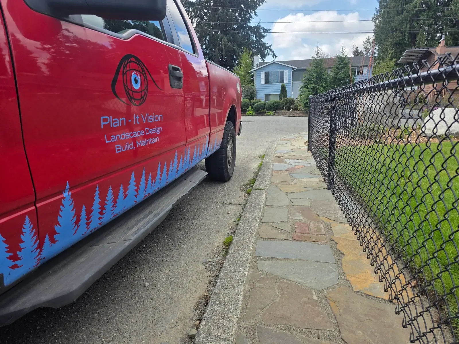 Plan-It Vision truck at the curb beside the finished flagstone walk