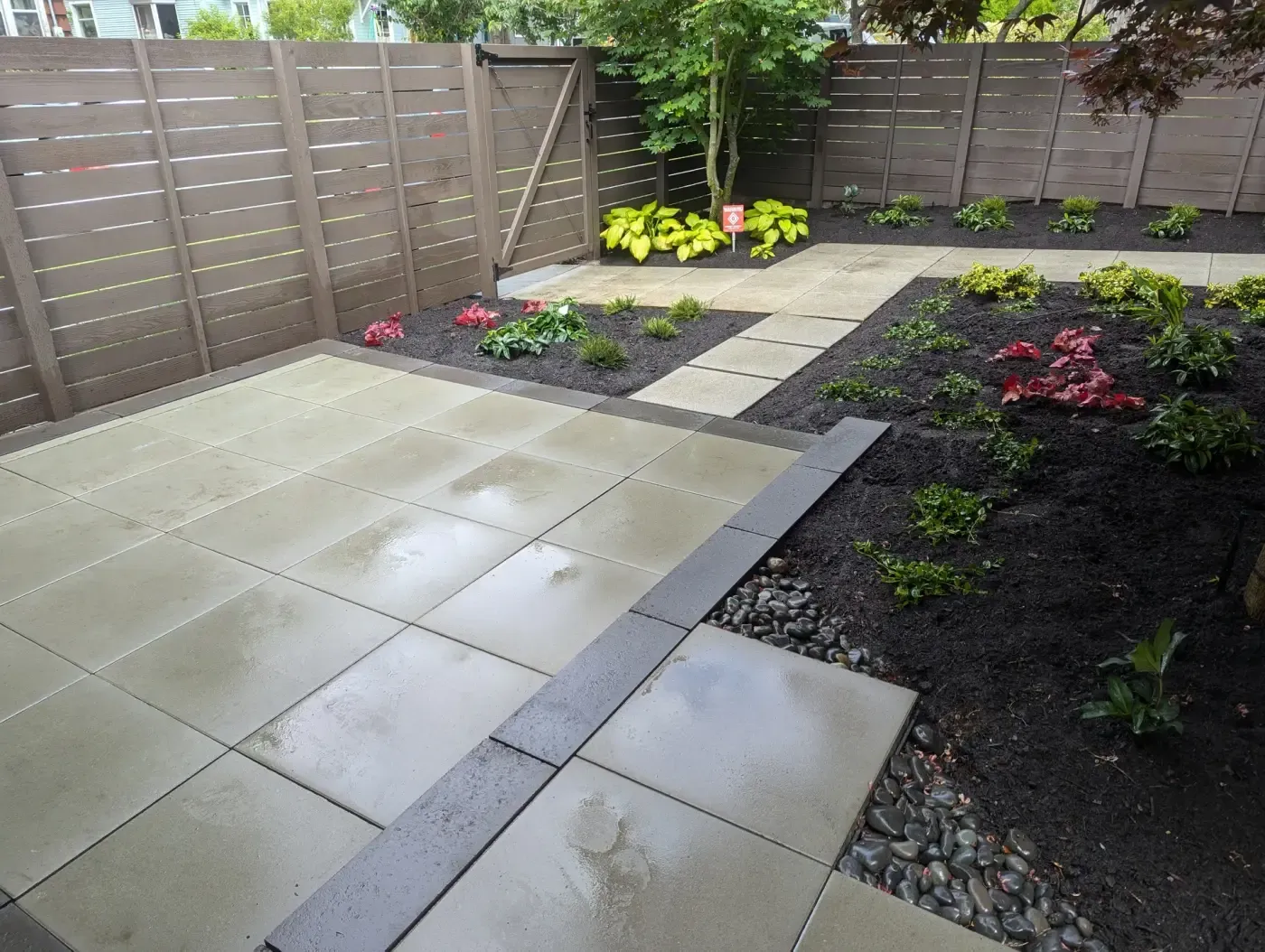 Pale concrete slab terrace trimmed with charcoal border band
