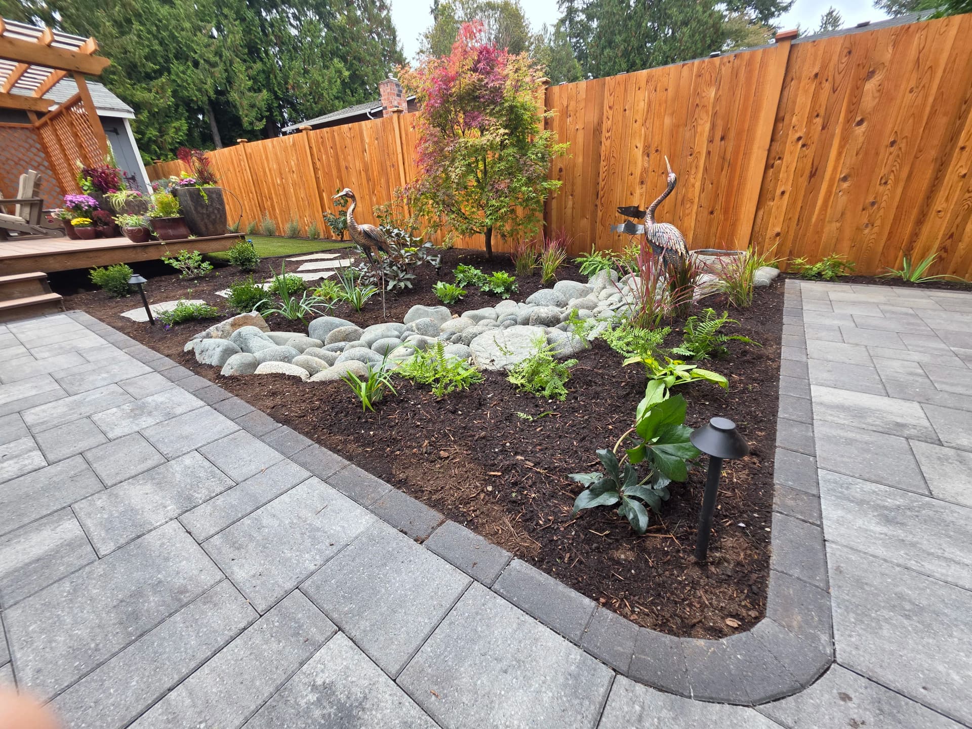 Gallery photos for Backyard Refresh With River Rock, Pavers, and Custom Plantings: Image #8